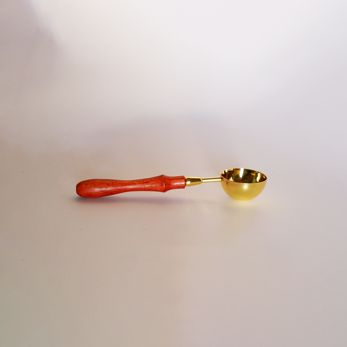 Gold wax melting spoon by Papier Plume, small metal spoon for wax melting and application, with a shiny gold finish.
