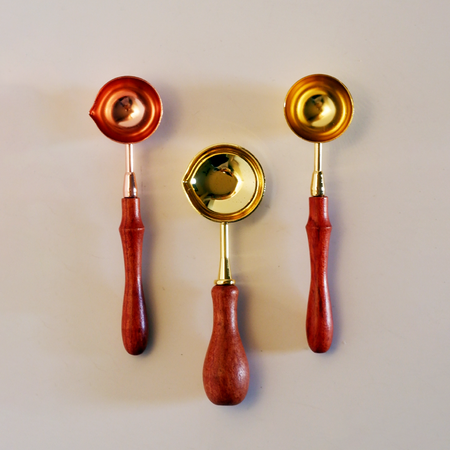 Papier Plume wax melting spoon with a sleek, stainless steel design for precise wax heating and application.