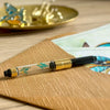 Esterbrook x BUNGUBOX Kingfisher Estie fountain pen with vibrant blue ink cap and gold accents, displayed on a white background.