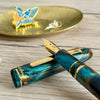 Esterbrook x BUNGUBOX Kingfisher Estie fountain pen with blue and gold accents, detailed close-up of the limited edition writing instrument