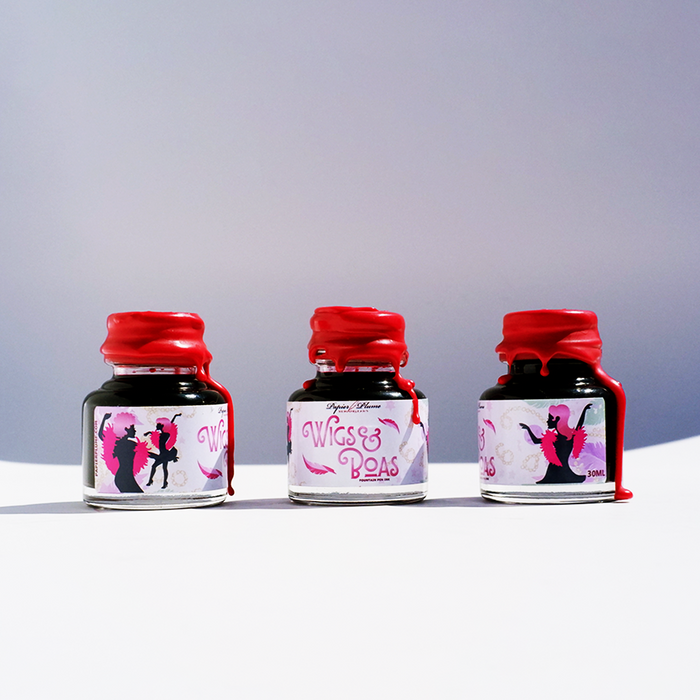 Papier Plume New Orleans Collection fountain pen ink bottle with vibrant ink inside, displayed on a white background.