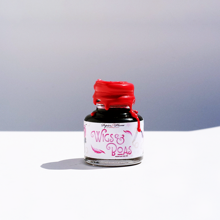 Papier Plume New Orleans Collection fountain pen ink bottle with vibrant blue ink, displayed on a white background.