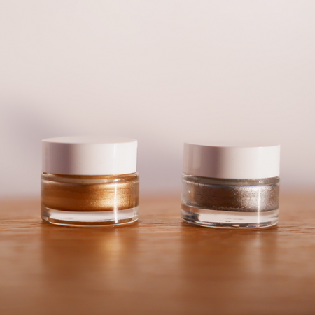 Bortoletti wax seal cream pots with amber-colored wax and decorative seals, ideal for vintage-style sealing and craft projects.